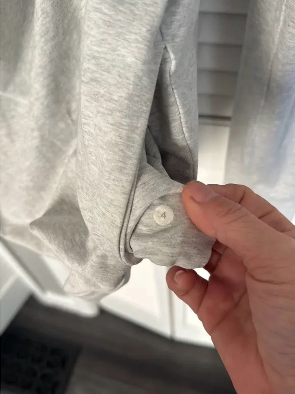Lululemon Sway Moto Jacket in light gray and white.